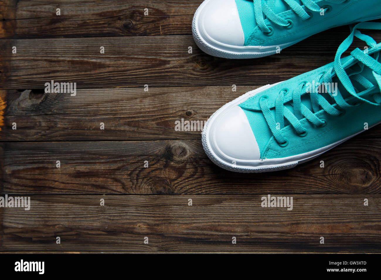 blue shoes on wooden floor Stock Photo Alamy
