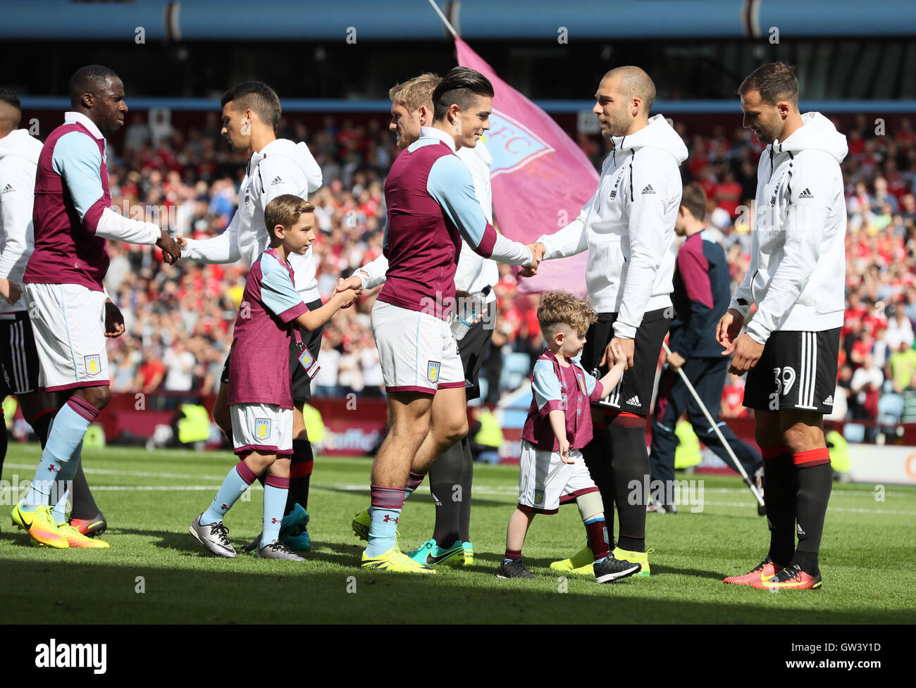 Aston Villa's Jack Grealish lines-up with mascot Carter Carrington during the Sky Bet Championship match at Villa Park, Birmingham. PRESS ASSOCIATION Photo. Picture date: Sunday September 11, 2016. See PA story SOCCER Villa. Photo credit should read: Martin Rickett/PA Wire. RESTRICTIONS: Editorial use only. Maximum 45 images during a match. No video emulation or promotion as 'live'. No use in games, competitions, merchandise, betting or single club/player services. No use with unofficial audio, video, data, fixtures or club/league logos. Stock Photo