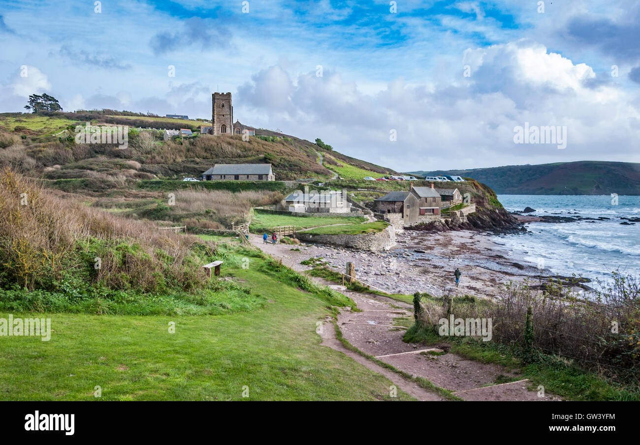 Coastal landscape at Wembury Beach, Devon, including Saint Werburgh's Church (distant) and part of the South West Coast Path. Stock Photo