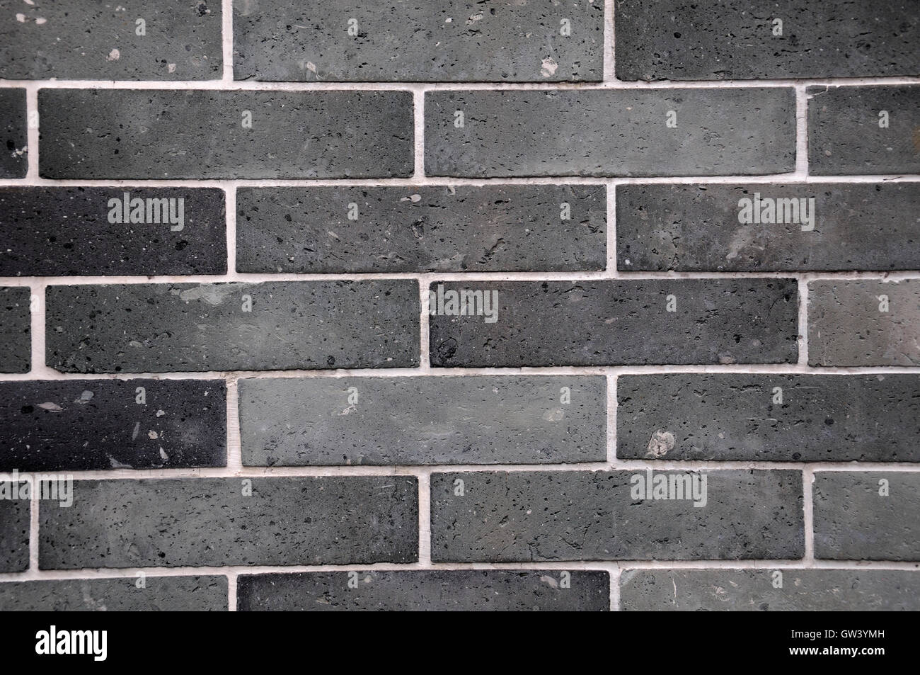 A black and gray brick wall background at a six banyan tree temple in