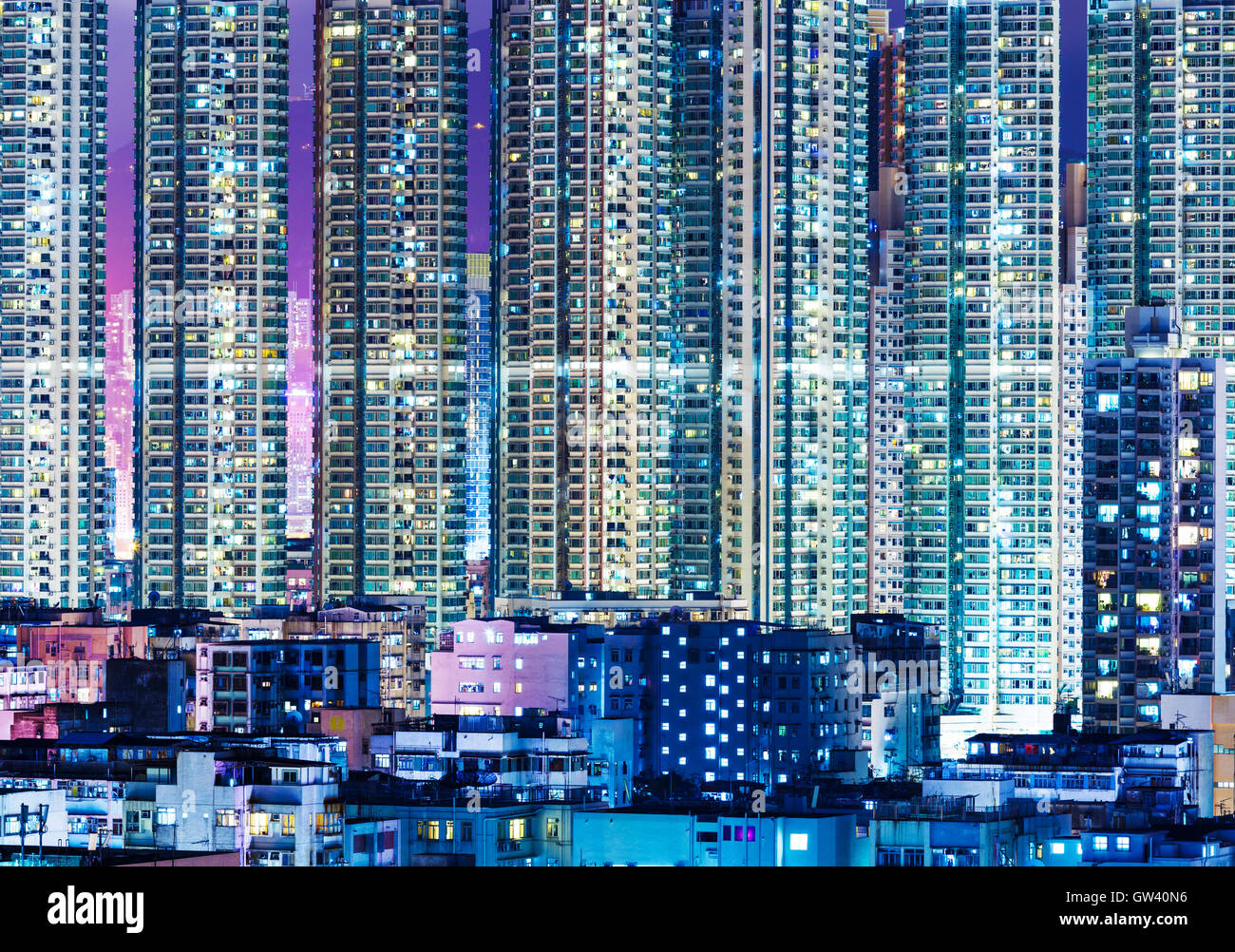 Overpopulated modern building in Hong Kong at night Stock Photo - Alamy