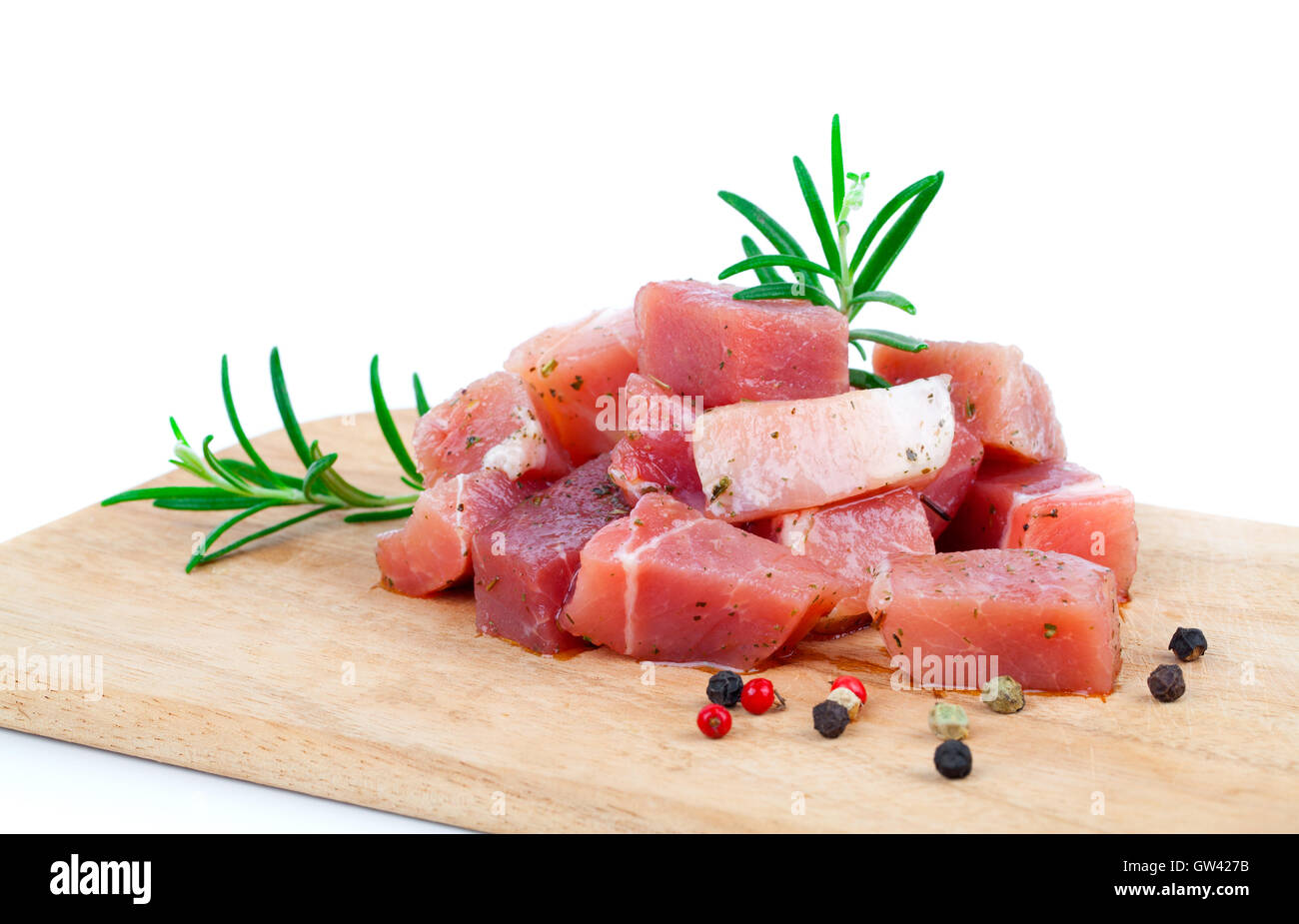 pieces of raw meat on a kitchen board, on a white background Stock ...