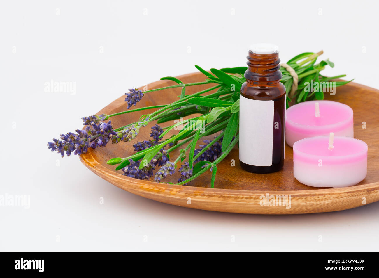 Aromatherapy Lavender oil and lavender flower in the wooden bowl Stock Photo