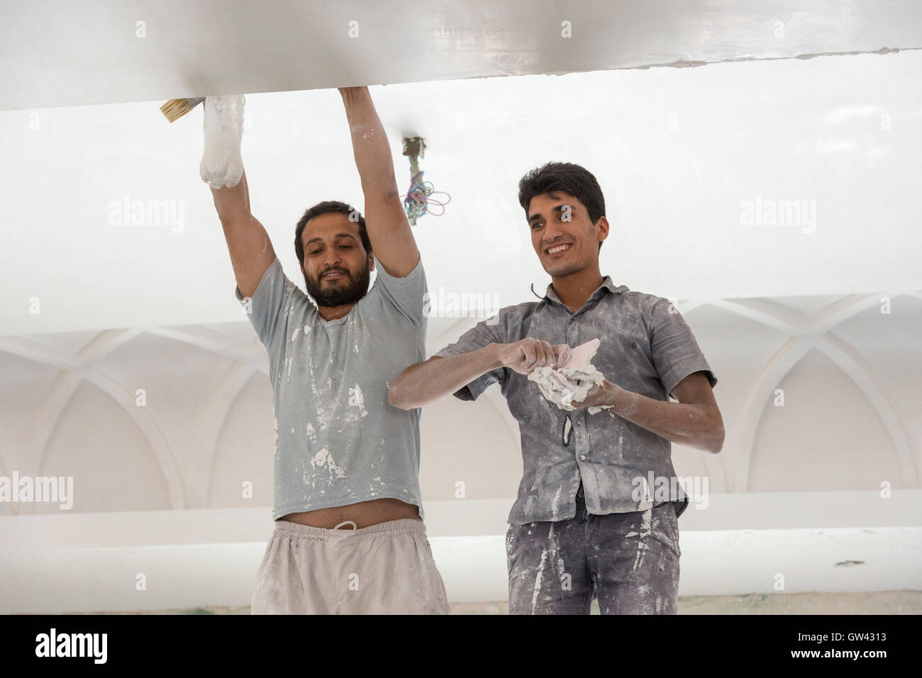 Chenesht Village, Workers Restoring Local Mosque Stock Photo