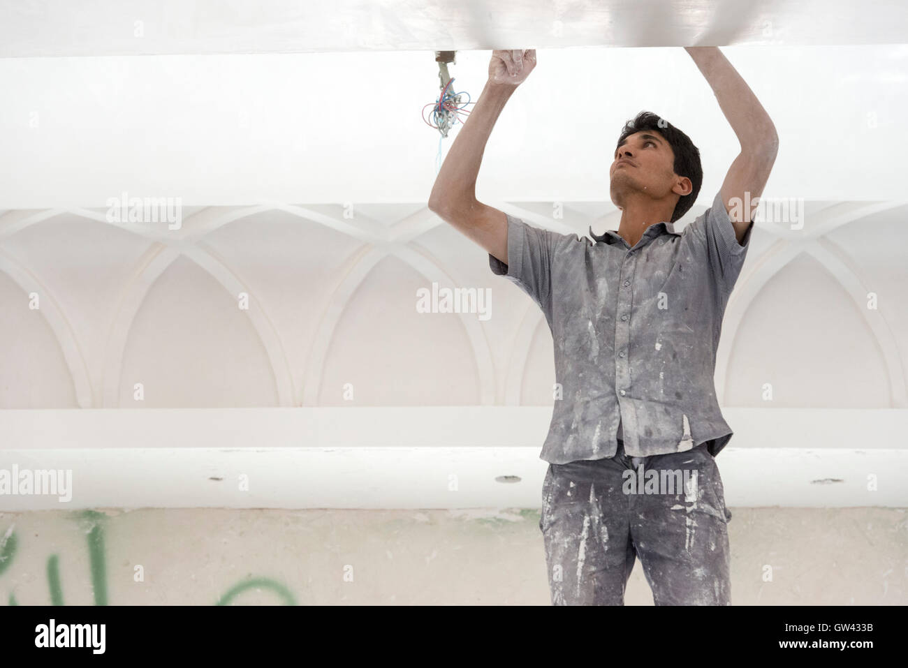 Chenesht Village, Worker Restoring Local Mosque Stock Photo
