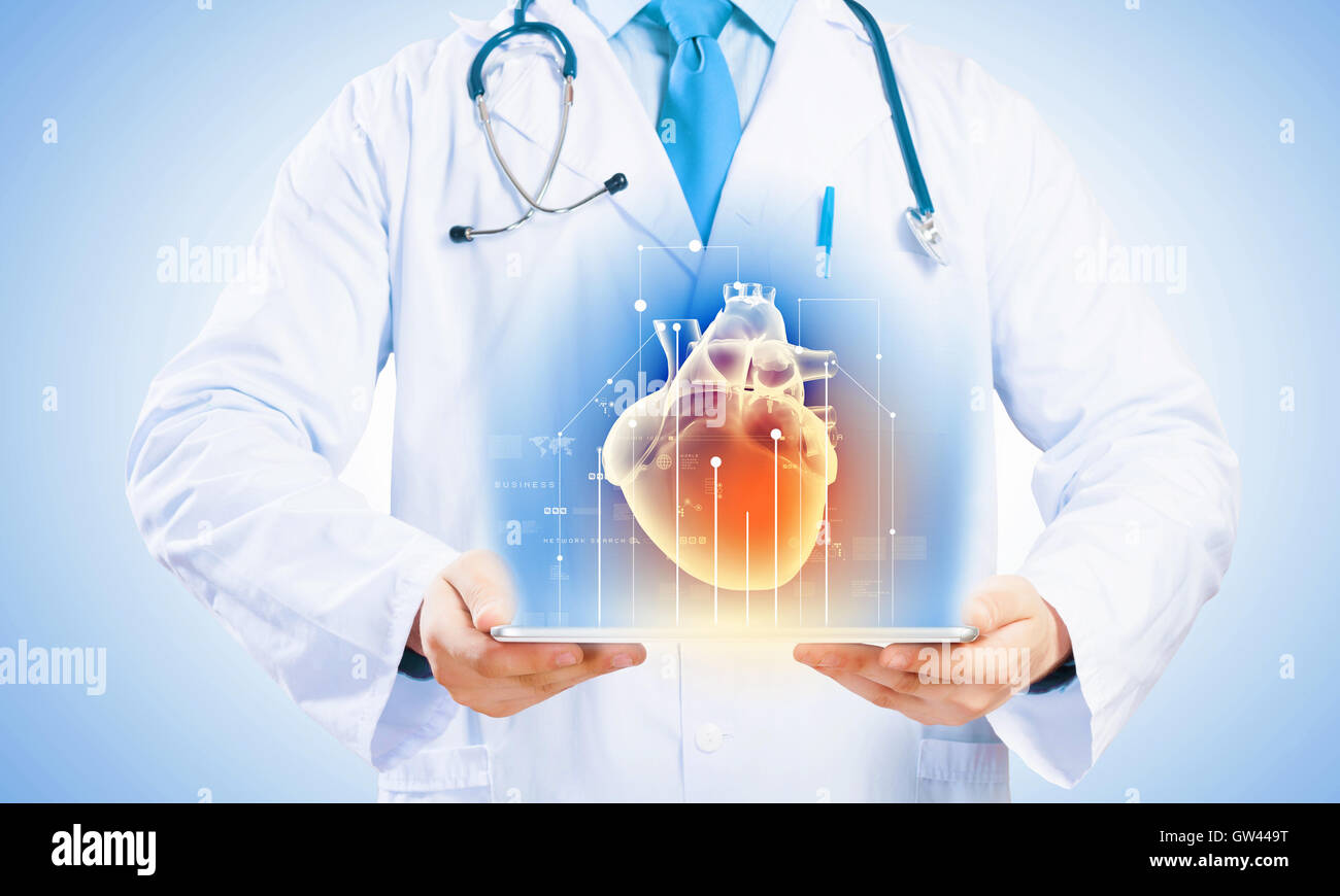 Doctor holding tablet pc Stock Photo - Alamy