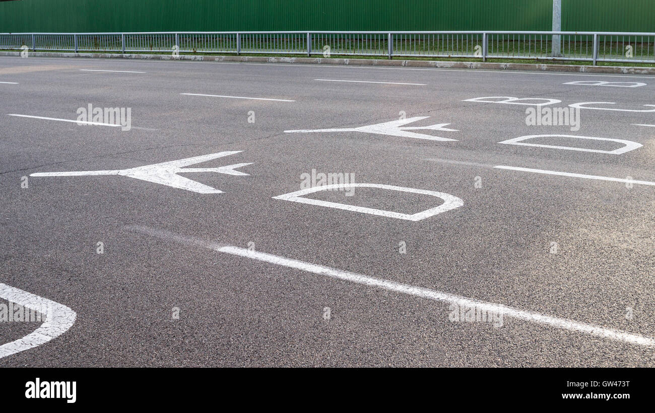 Airport directional signs on the road. White colored airplane signs and ...