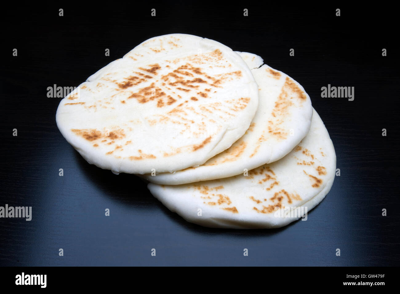 Naan, nan or khamiri is from North India and a leavened, oven-baked flat bread Stock Photo