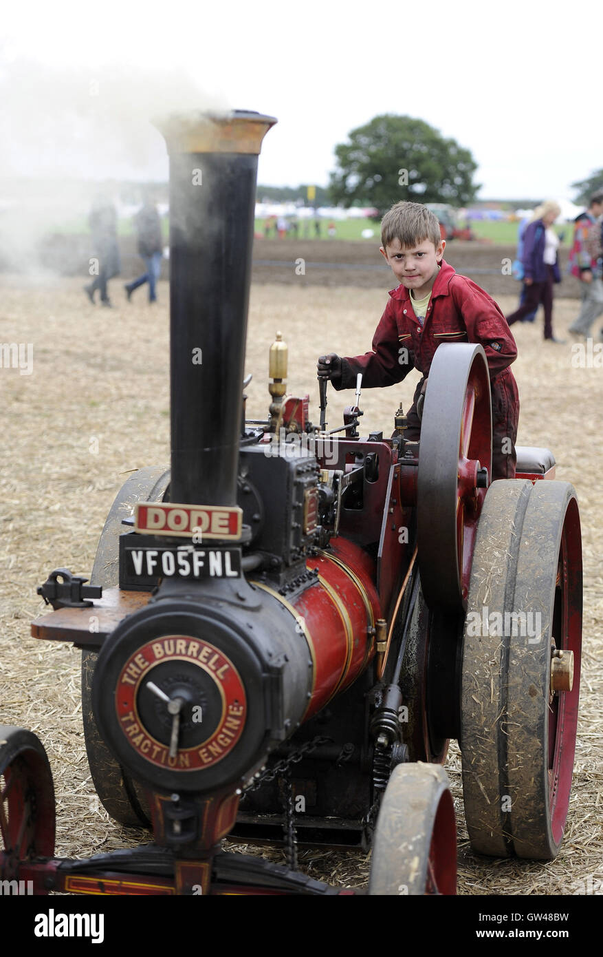 Seven-year-old Tom Debes on this 6HP Burrell at the World Ploughing Contest at Crockey Hill near York, where representatives from over thirty countries competed in various categories that included vintage and horse drawn alongside conventional tractors. Stock Photo