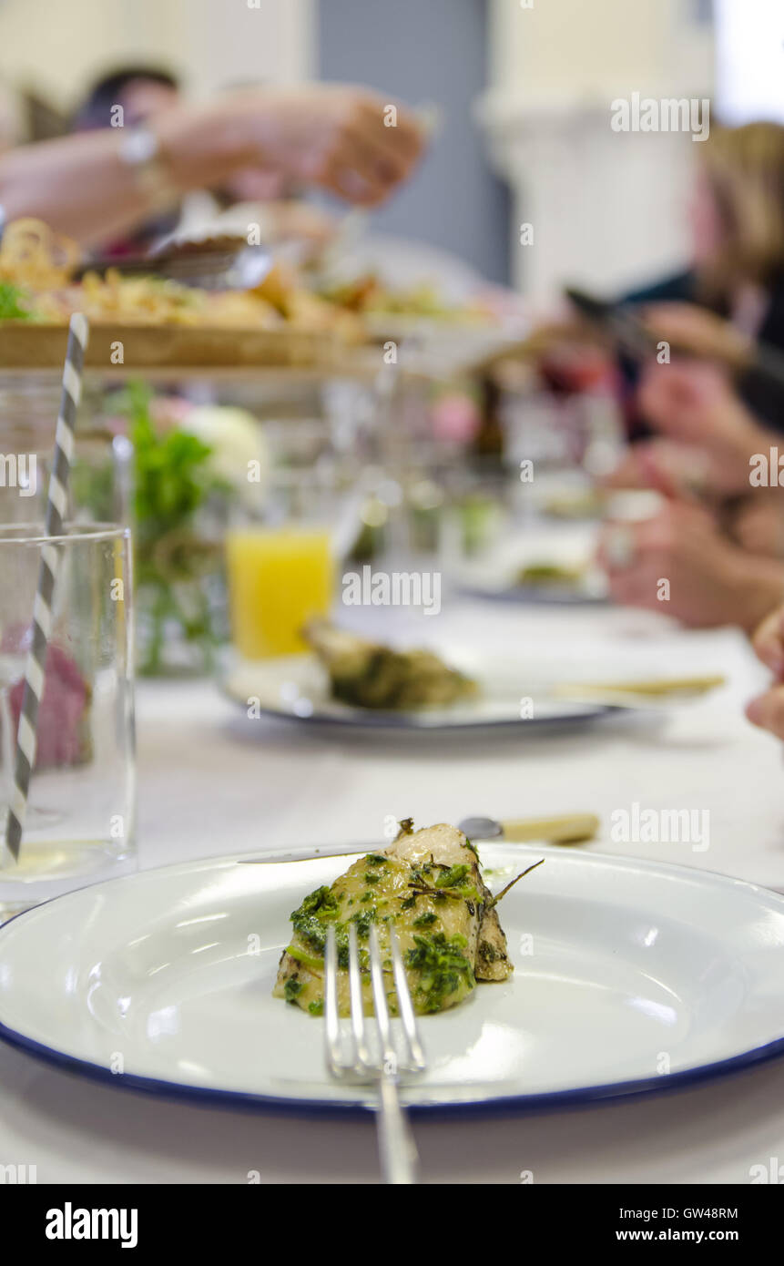Chicken wirh salsa verde served at the venue Stock Photo
