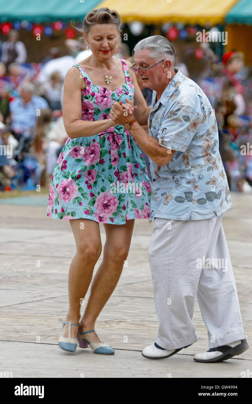 Festival couple enjoy dancing 1940s style - Lindy Hop / jive Stock Photo