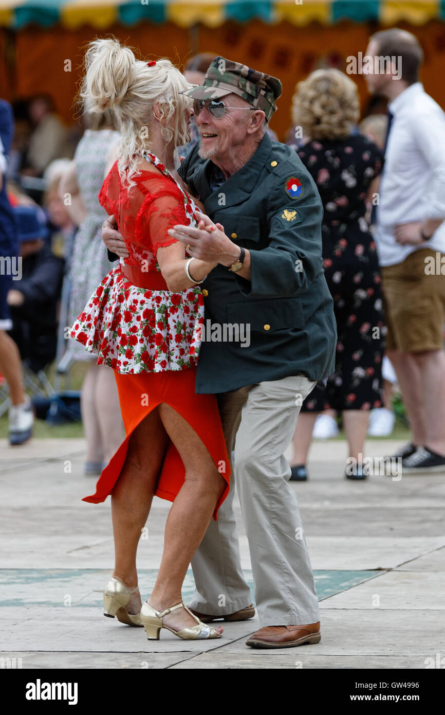 Festival going couple enjoy dancing 1940s style - Lindy Hop / jive Stock Photo