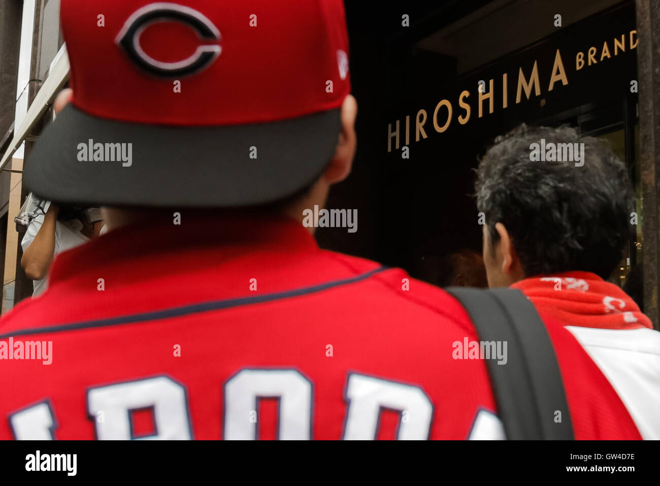 Hiroshima Carp baseball team fans line up outside Hiroshima Brand Shop