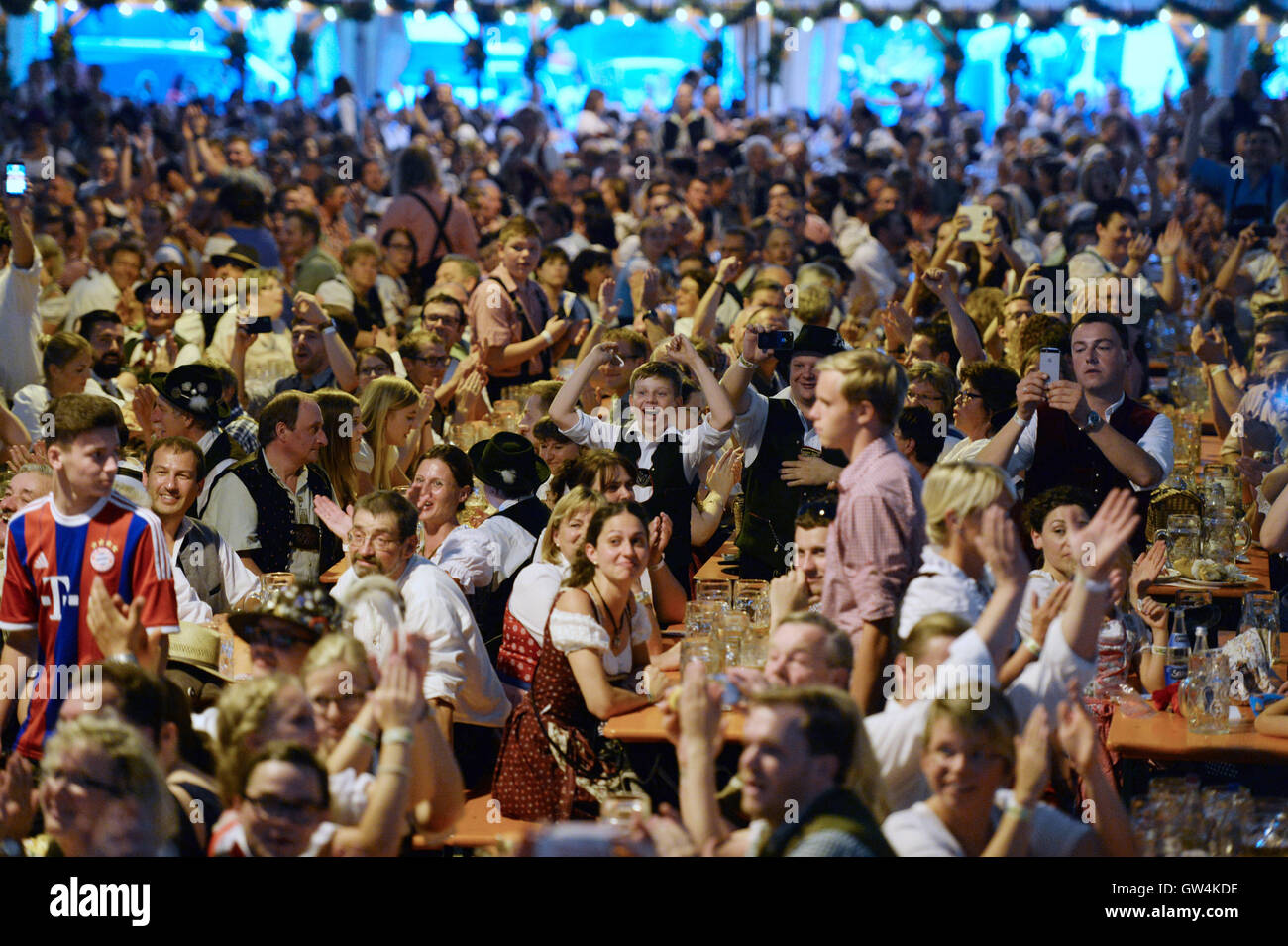 Beilngries, Germany. 11th Sep, 2016. Participants celebrating the result of the world record attempt in the festival tent at the folk festival in Beilngries, Germany, 11 September 2016. Beilngries secured an entry in the Guinnes World Records book with 3,414 people wearing traditional costumes in a festival tent. PHOTO: ANDREAS GEBERT/dpa/Alamy Live News Stock Photo