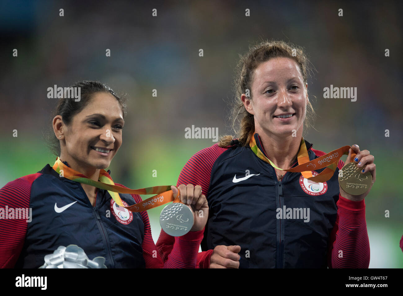 USA's Tatyana McFadden (R)  and Cheri Madsen show off medals for the women's 400-meter T54 race at the Rio 2016 Paralympics. Stock Photo