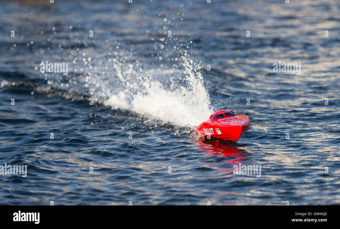 RC model boat in full speed on the water Stock Photo