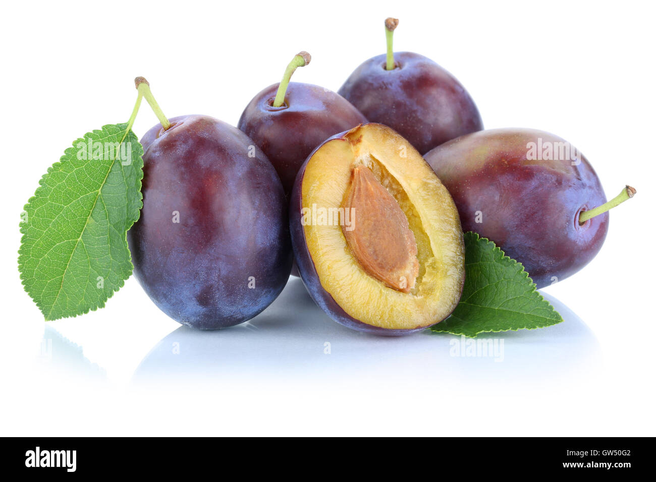 Plums plum prunes prune slice leaves fruits fruit isolated on a white background Stock Photo