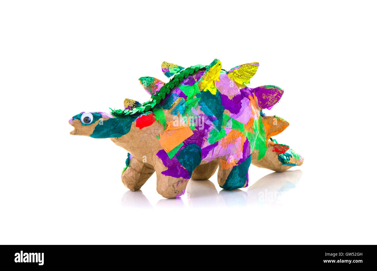 Colouful Hand Made Paper Mache Dinosaur on a White Background Stock Photo