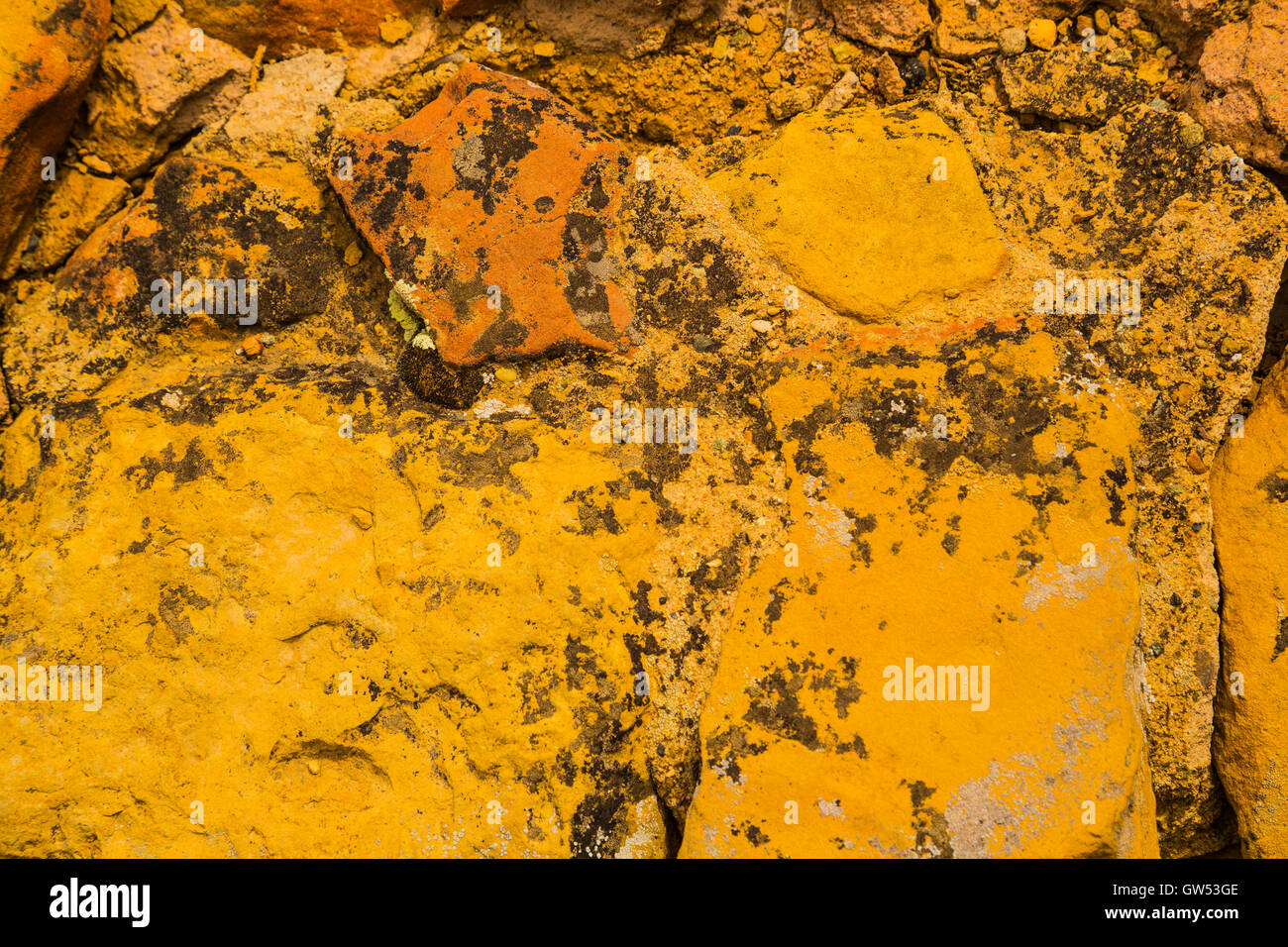 A rock with red or orange colored stone surface Stock Photo - Alamy