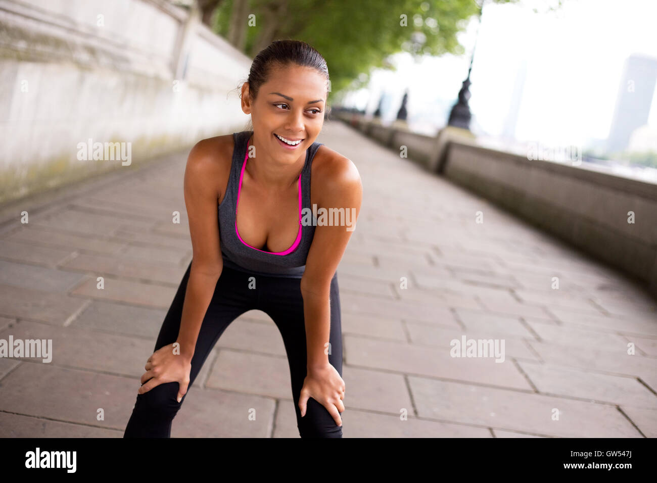 happy young woman out exercising Stock Photo