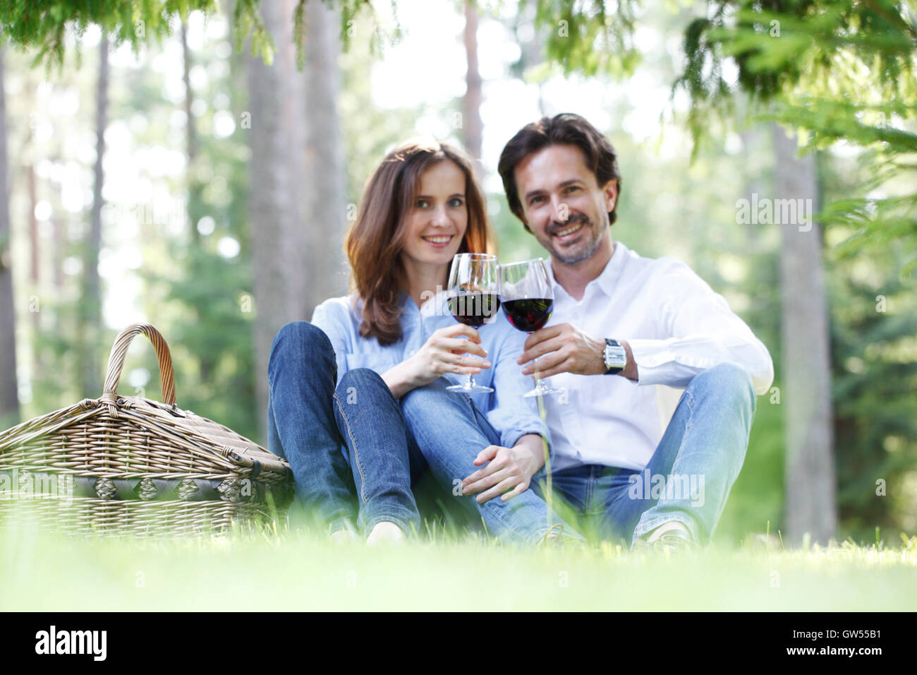 Young beautiful couple on picnic in summer park Stock Photo - Alamy