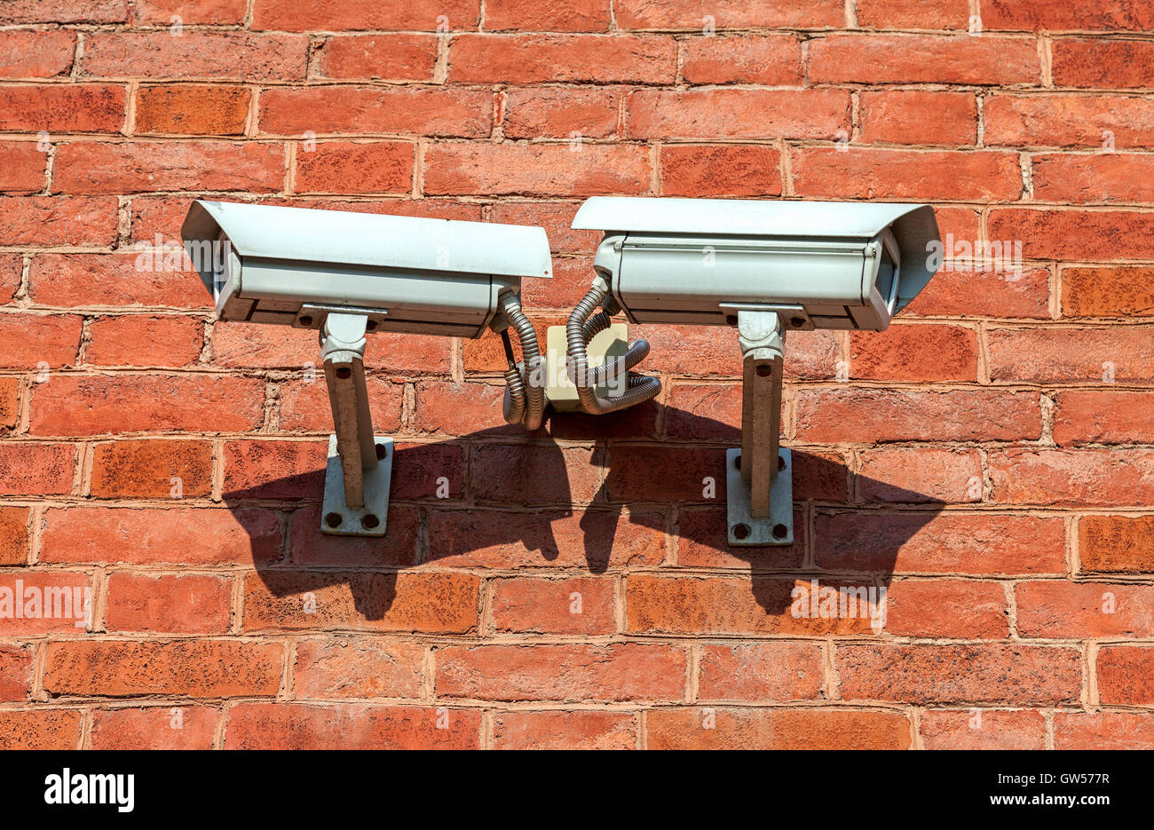 Surveillance cameras mounted on the wall of the building Stock Photo