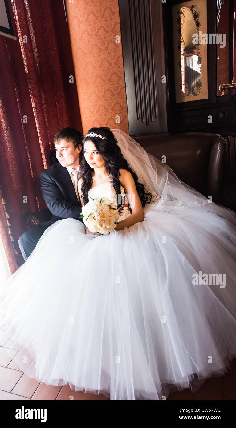Wedding couple indoors is hugging each other Stock Photo - Alamy