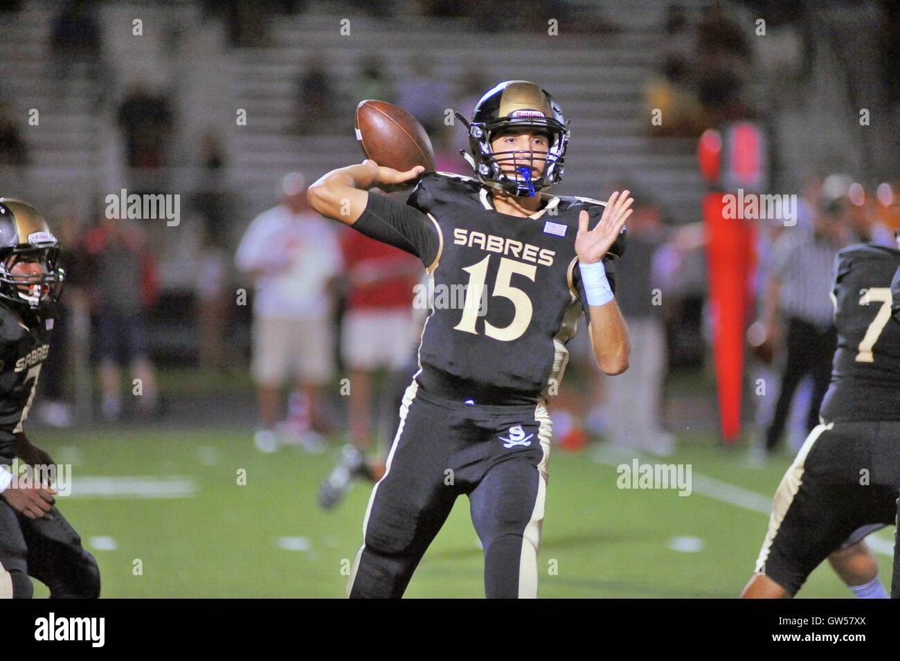 Quarterback throwing high school hires stock photography and images