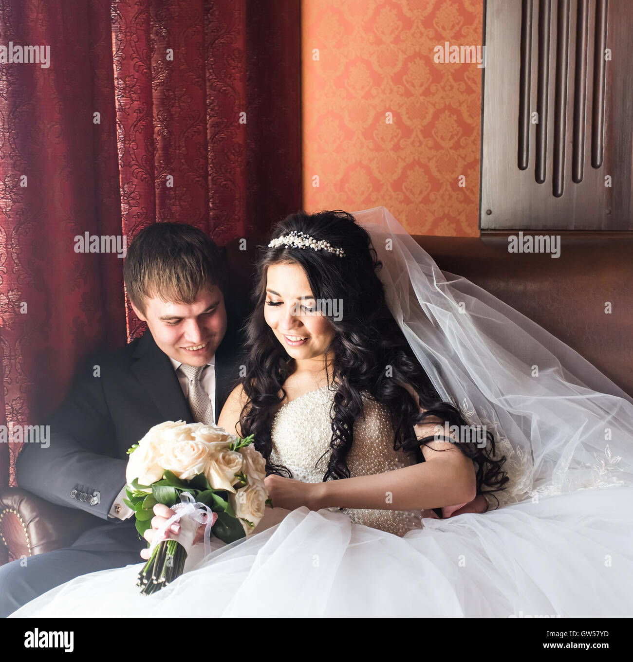 Wedding couple indoors is hugging each other Stock Photo - Alamy
