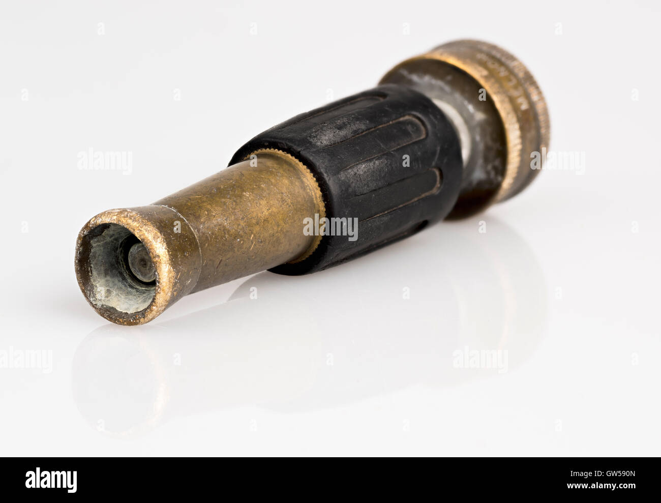 Nozzle for a garden hose that has been well used Stock Photo