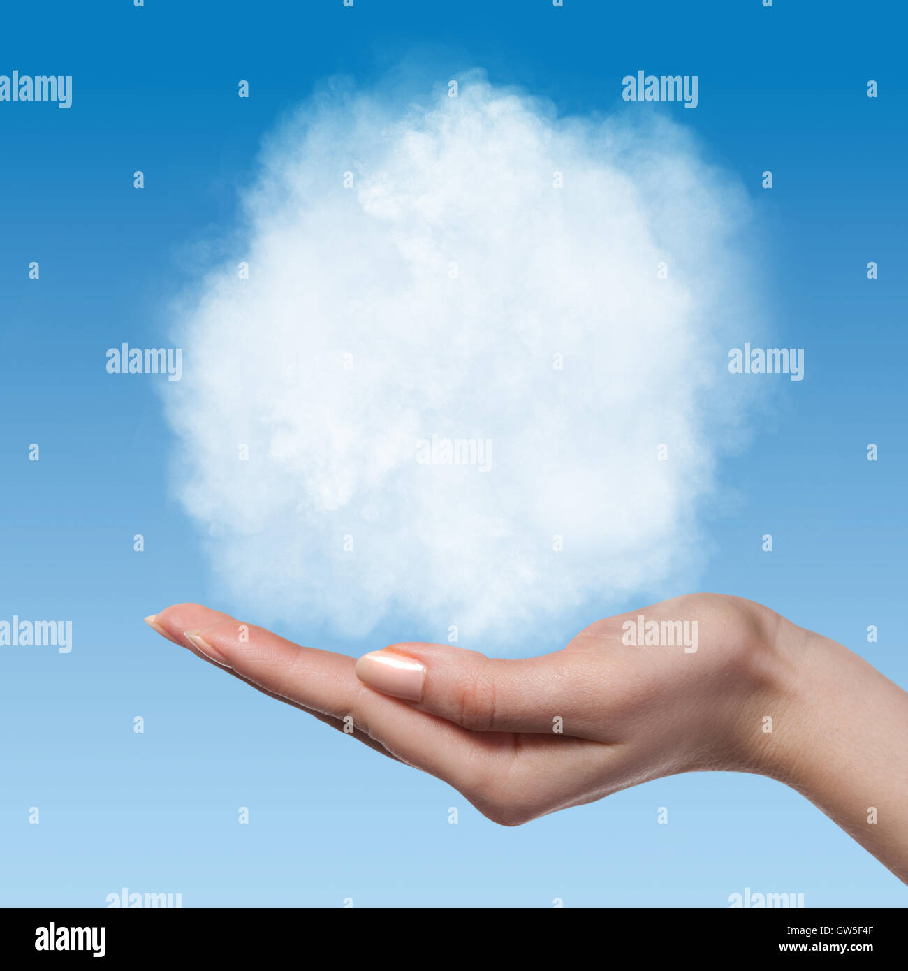 Cloud in woman hands on blue sky Stock Photo - Alamy