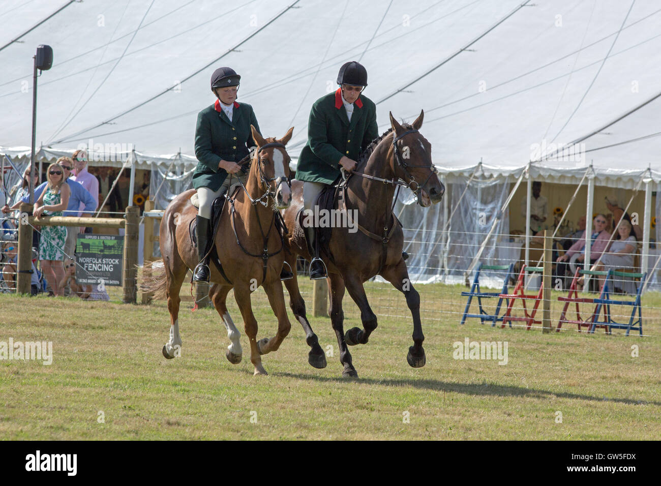 Aylsham Agricultural Show. Riders on Horse-back, to lead demonstration packs of hounds into the main ring. Norfolk. England. Stock Photo