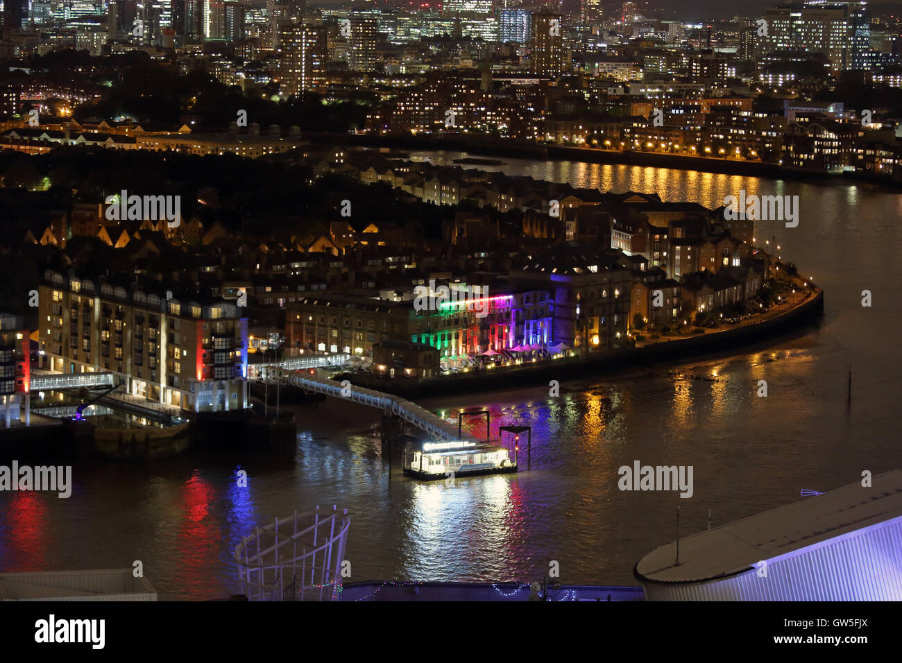 Night view of Nelson Dock Pier, Columbia Wharf and the River Thames from Marsh Wall, Canary Wharf, London, UK, E14 Stock Photo