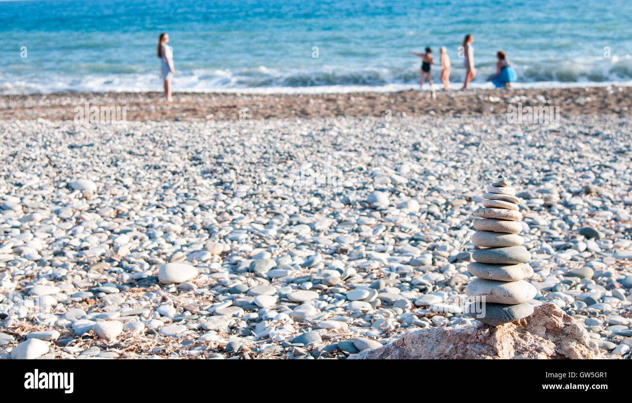 Pyramid of balancing pebbles,in the ocean Stock Photo
