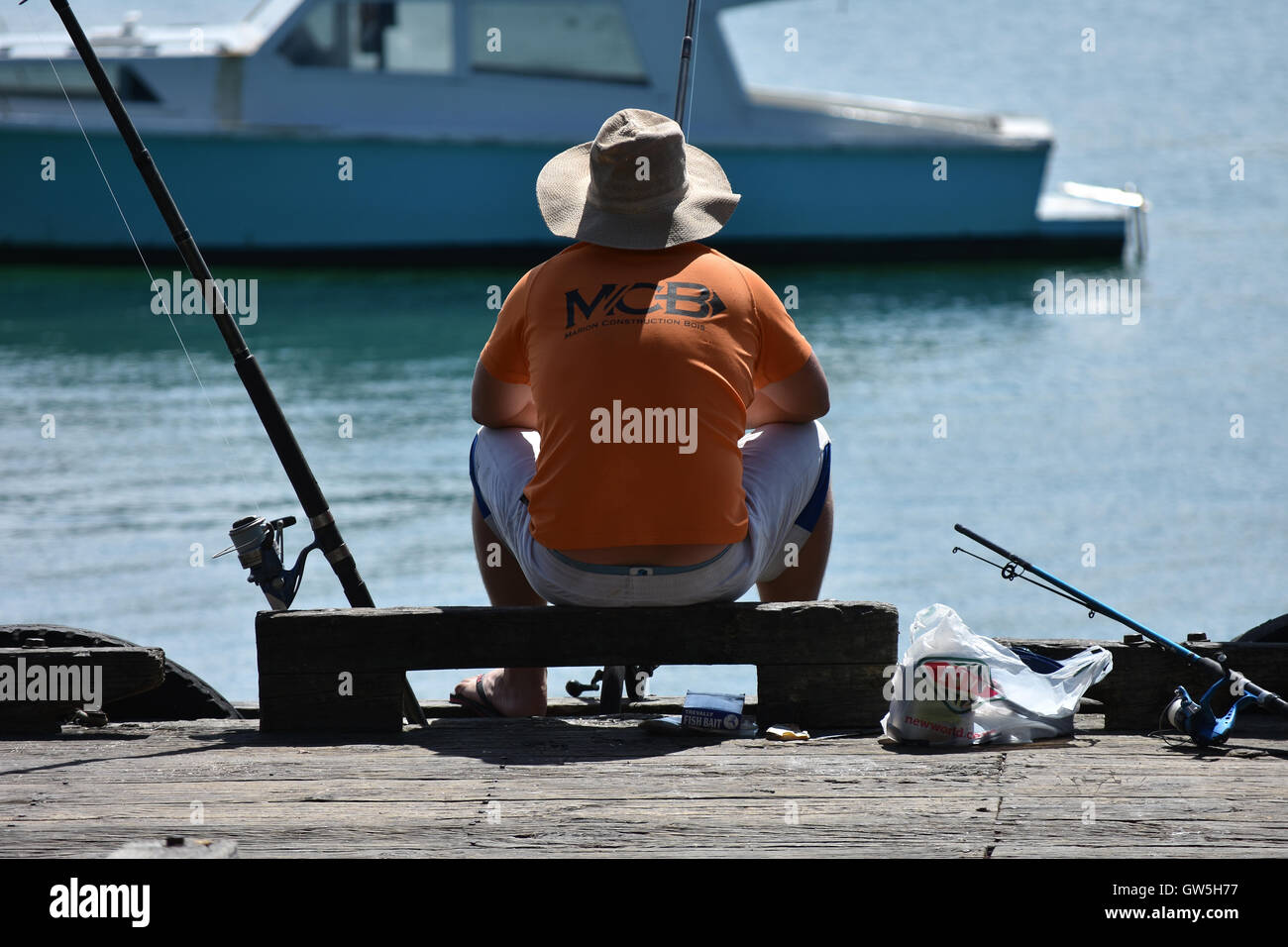 Man fishing from jetty hires stock photography and images Alamy