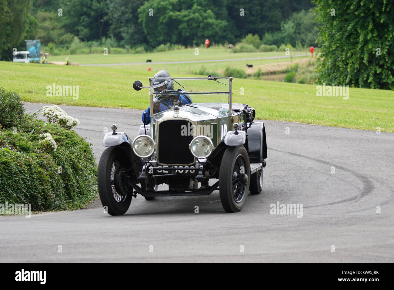 David Marsh guides his 1923 Vauxhall 30-98 into the roundabout at the 2016 Chateau Impney Hill Climb Stock Photo