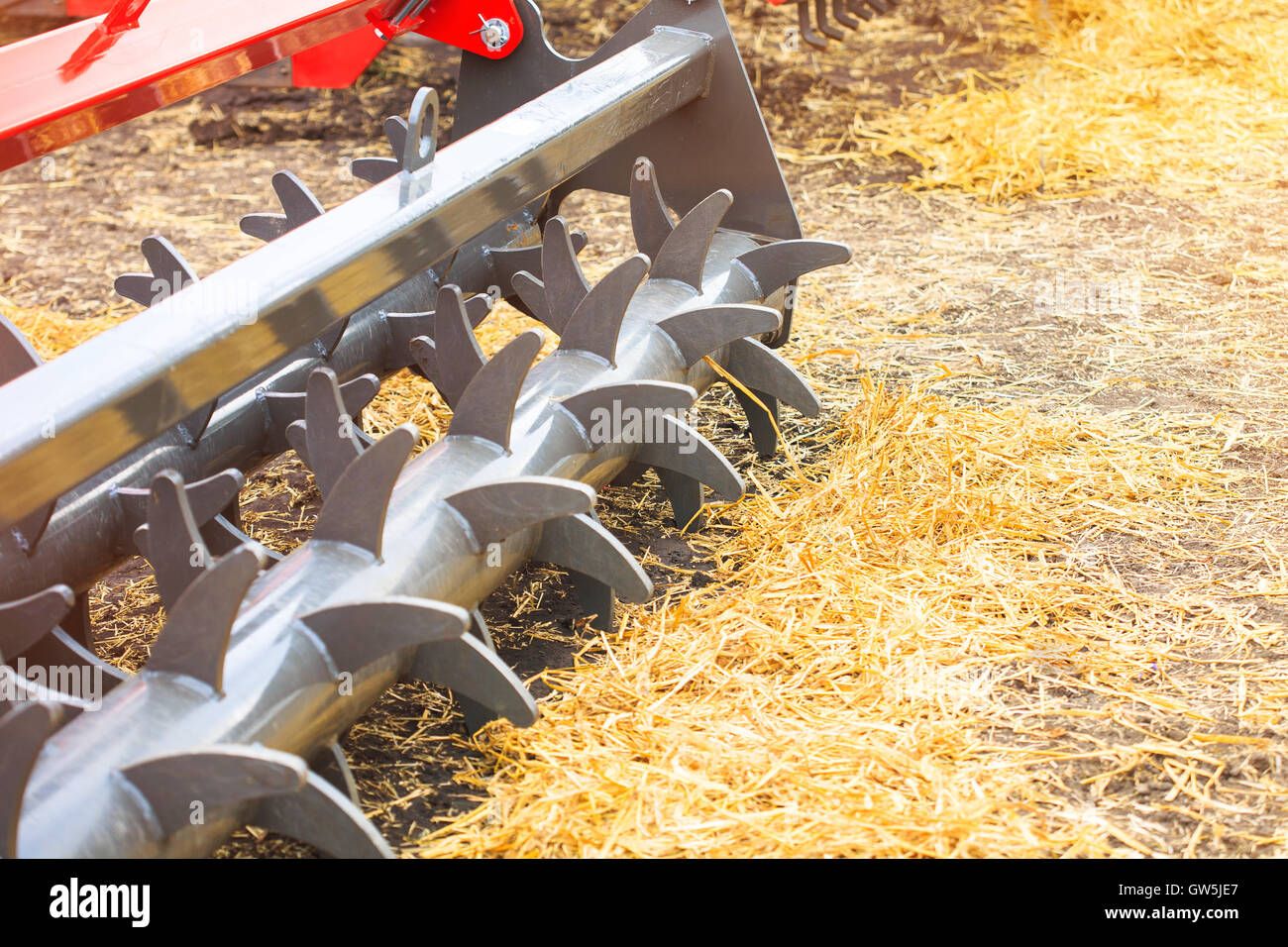 Agricultural cultivator close-up on the ground, farm equipment Stock Photo