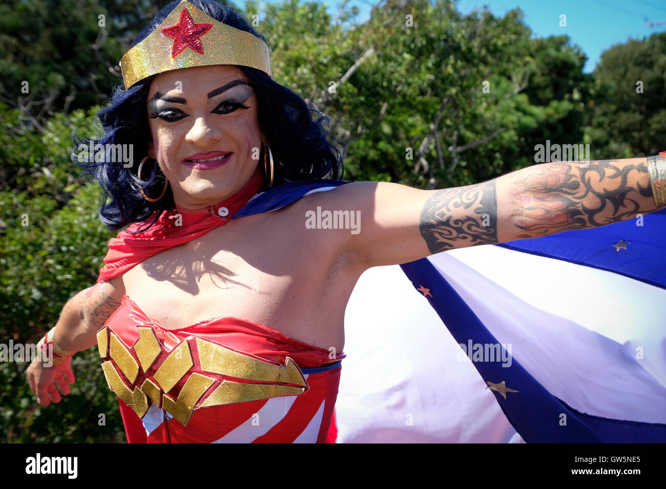 Drag queen in Wonder Woman costume and wig dressed for a Carnival parade Stock Photo