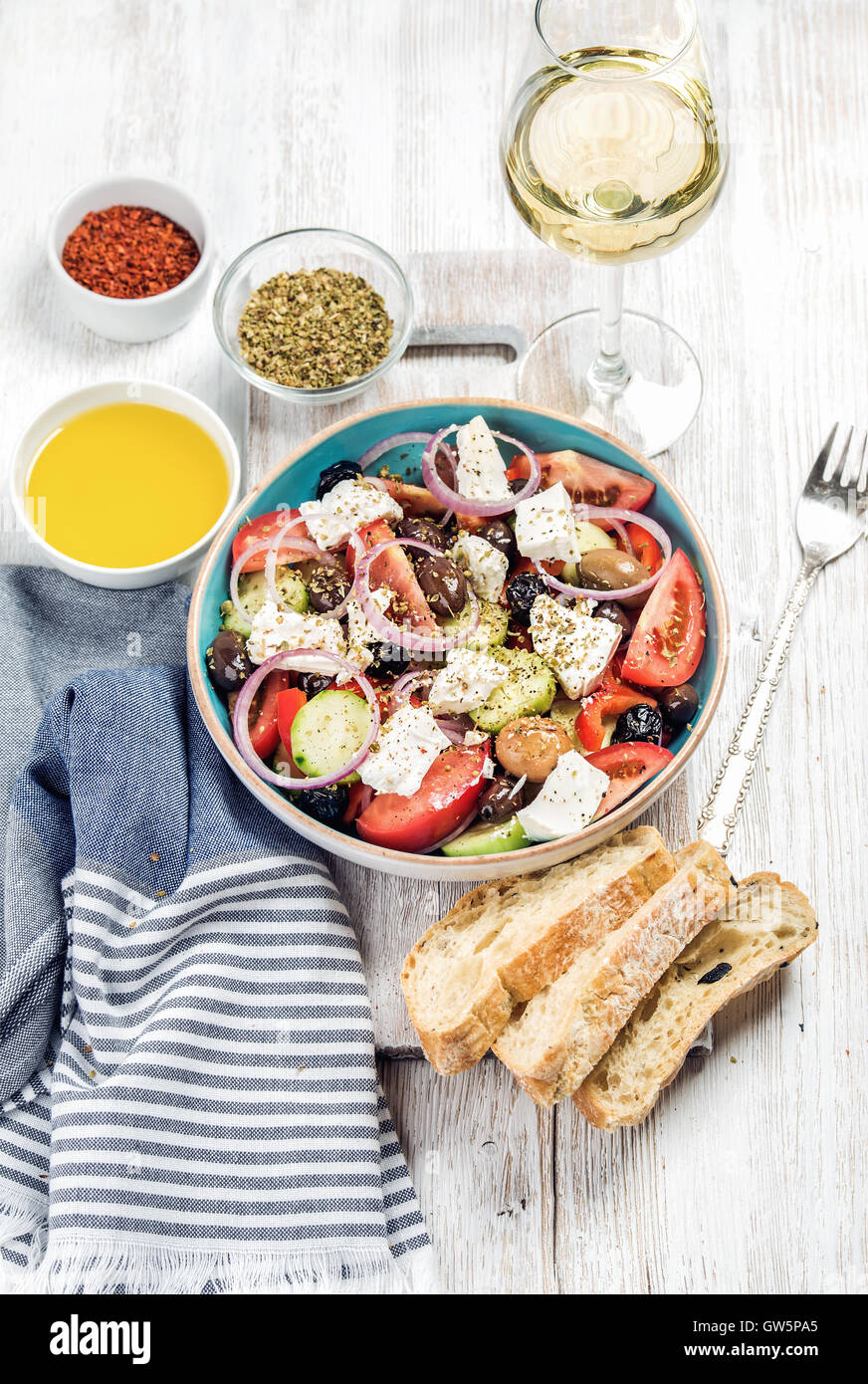 Greek salad with olive oil, bread slices, spices, white wine Stock