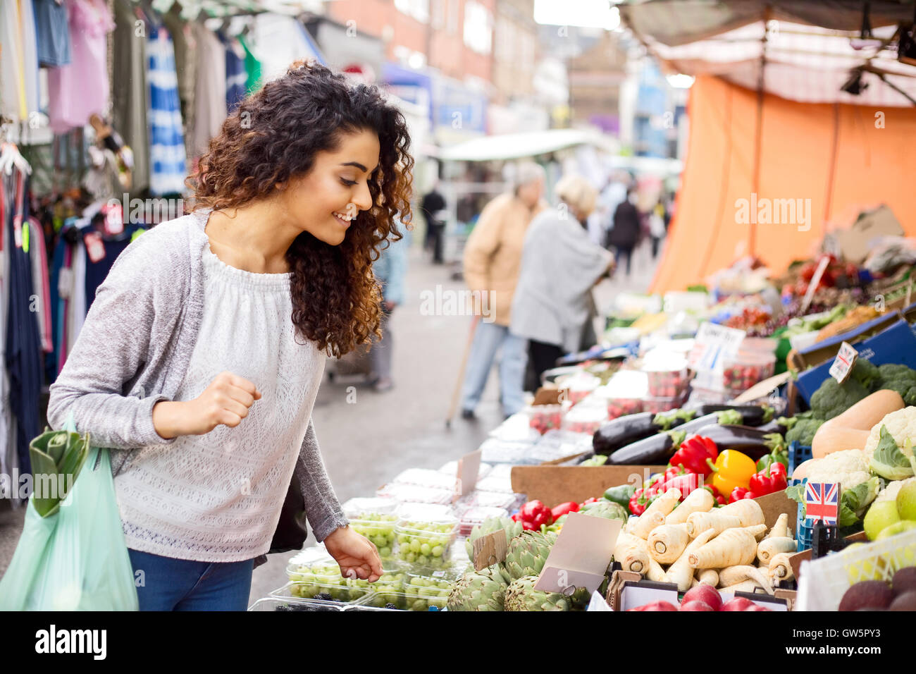 young woman shopping for her fruit and veg Stock Photo