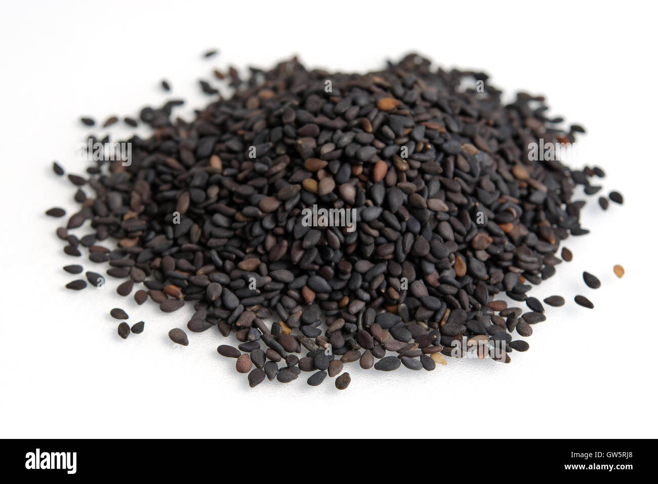 Black sesame seeds isolated on white (also called as Sesamum Indicum