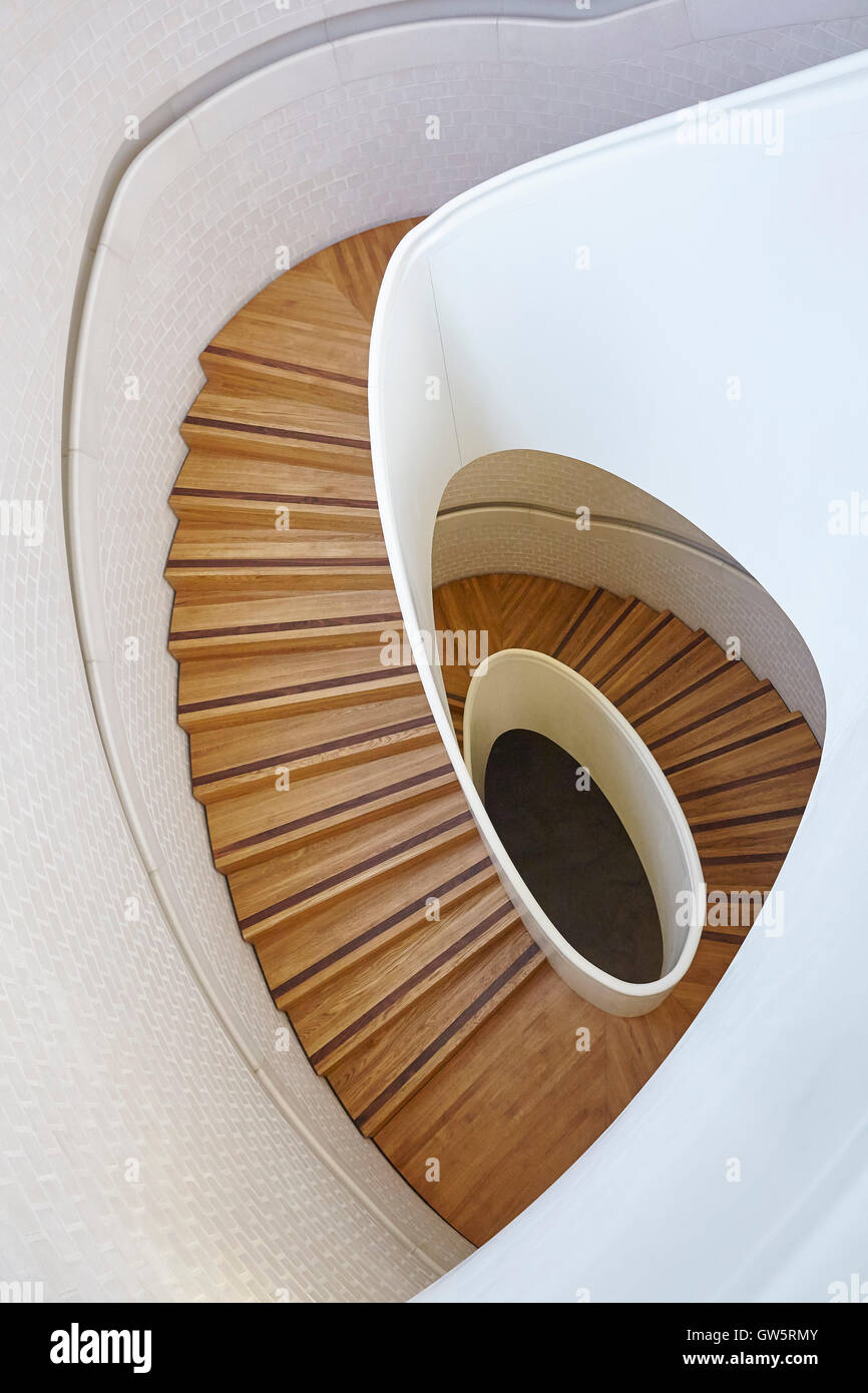 Looking down the finely crafted spiral staircase. NEWPORT STREET GALLERY, London, United Kingdom. Architect: CARUSO ST JOHN, 2016. Stock Photo