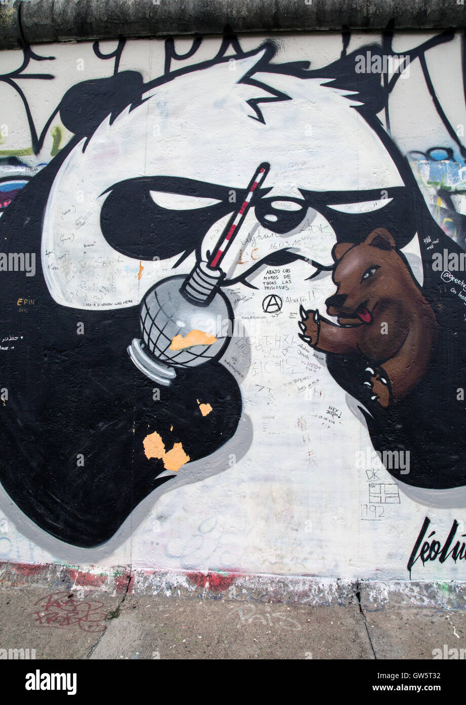 Street art on the Berlin Wall (East Side Gallery), showing a panda holding the Berlin TV tower and symbolic Berliner bear Stock Photo