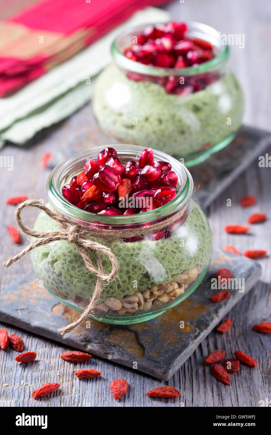 Chia seeds matcha pudding with pomegranate and chia seeds Stock Photo