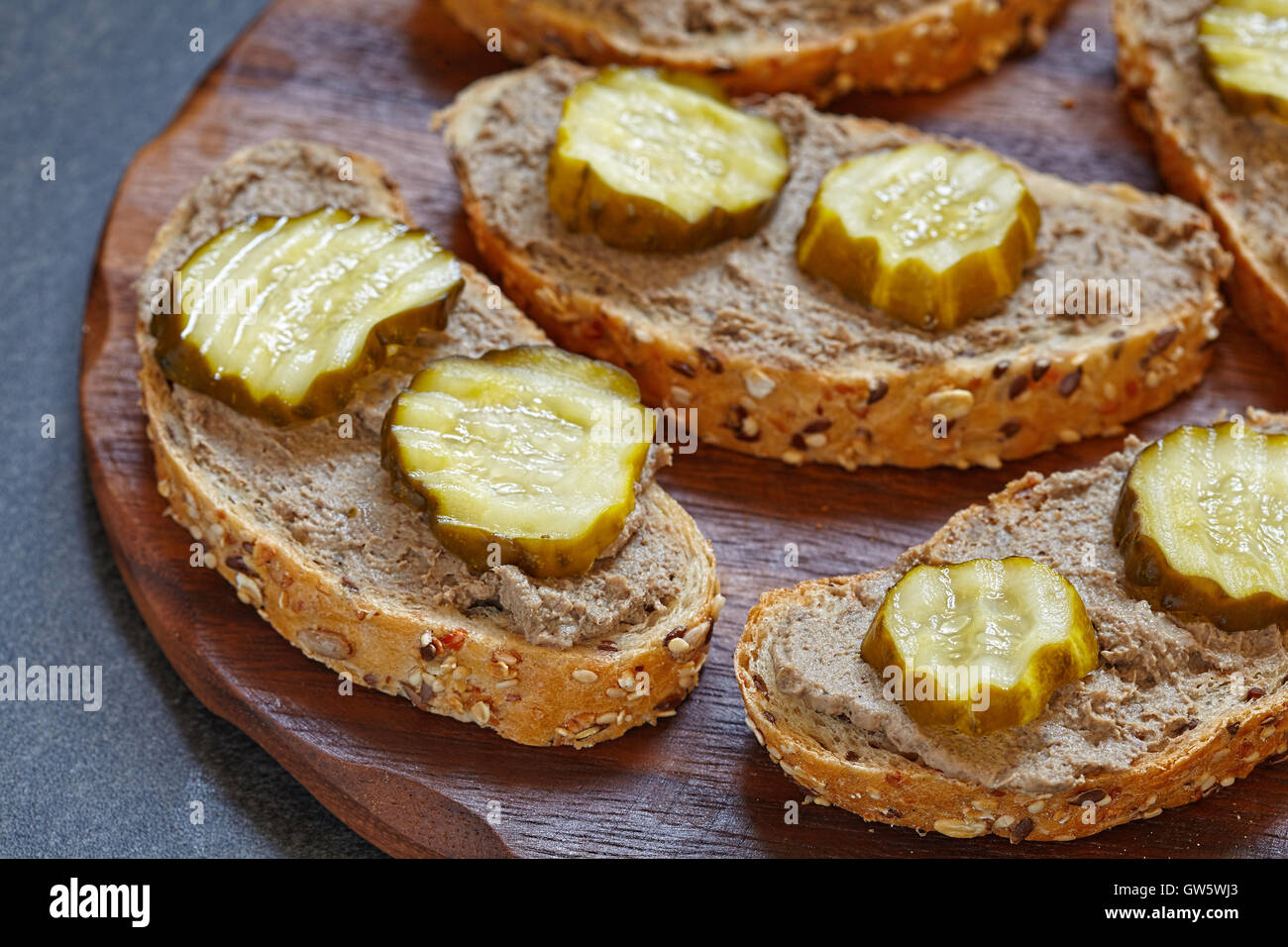 bread with liver pate and pickle cucumber Stock Photo
