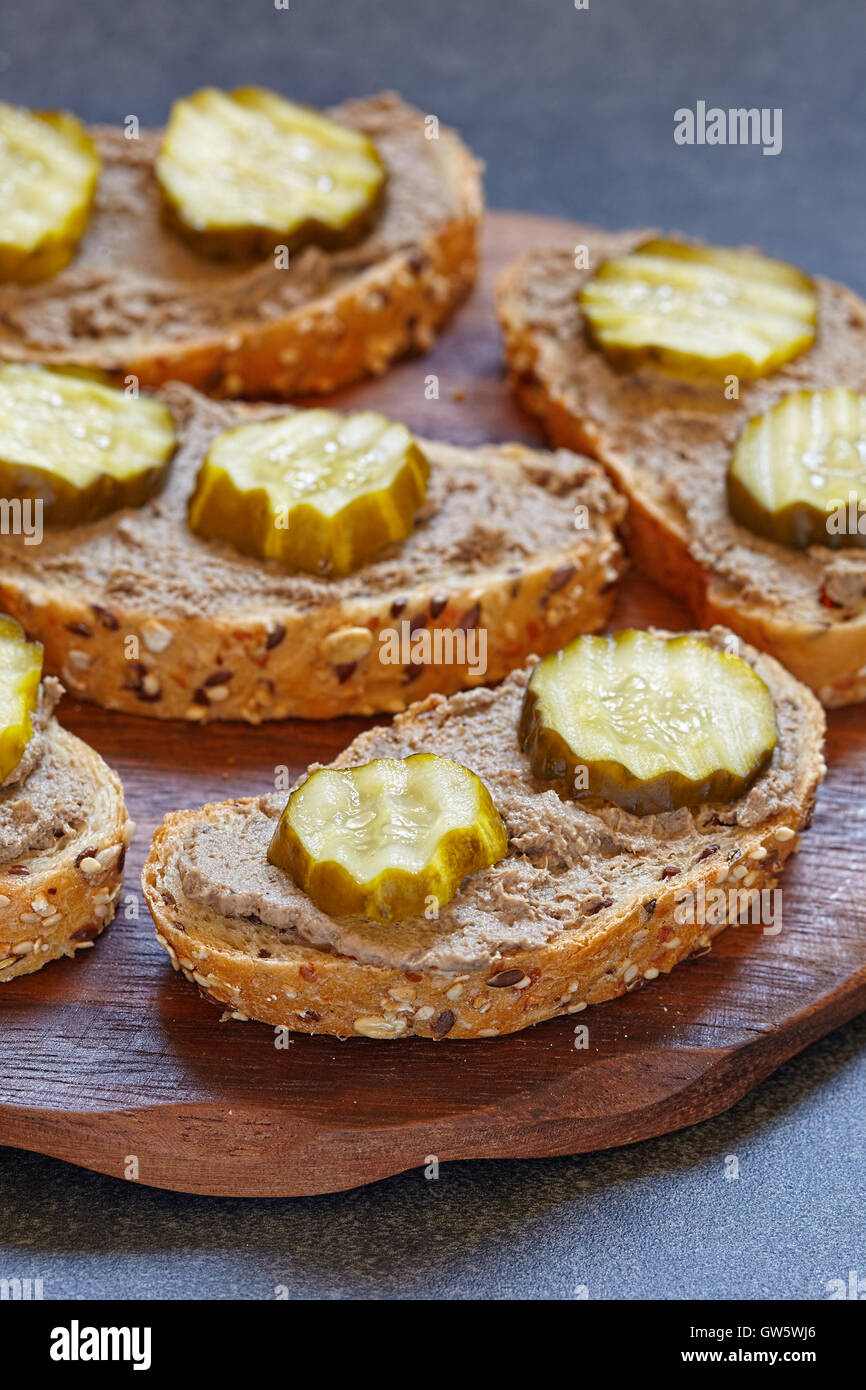 bread with liver pate and pickle cucumber Stock Photo