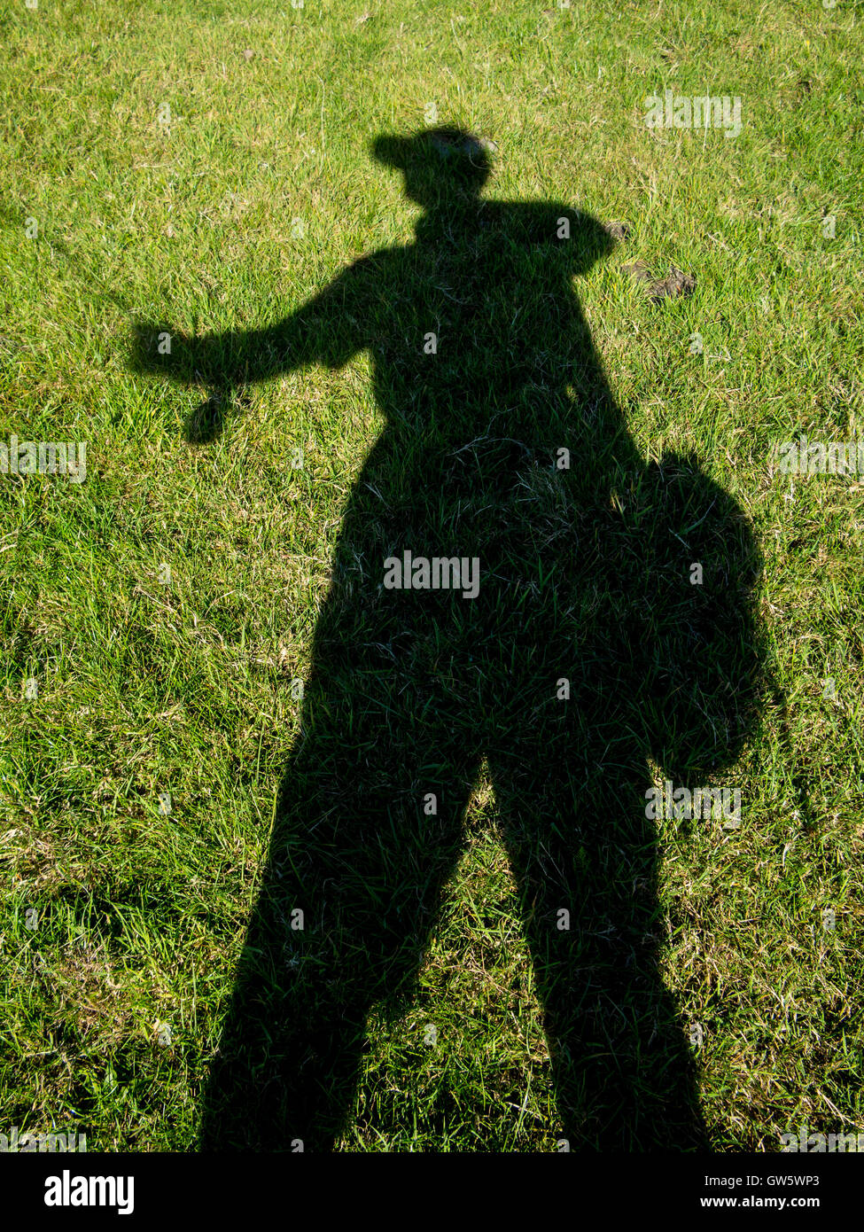 Silhouette of a fly fisherman casting Stock Photo