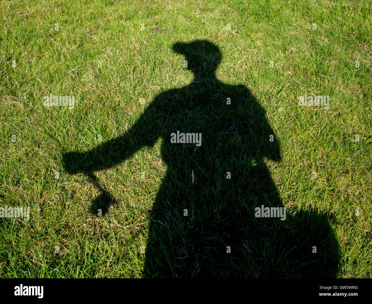 Silhouette of a fly fisherman casting Stock Photo