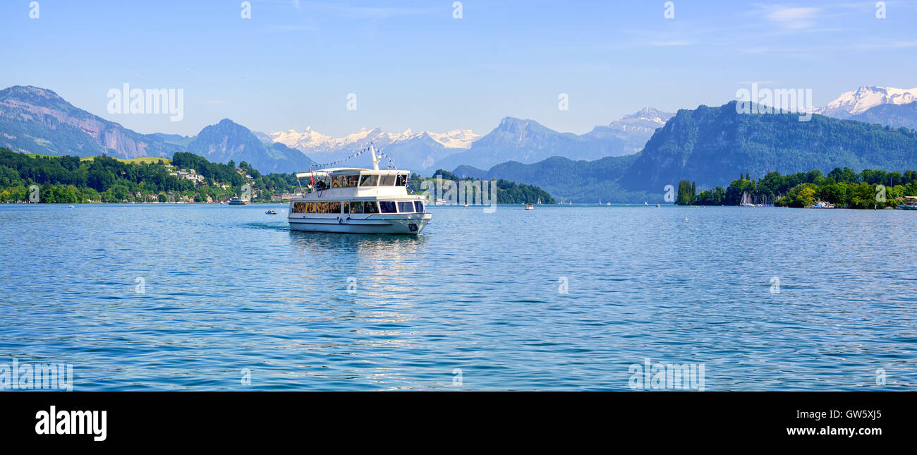 Cruise ship in front of snow covered Alps mountains peaks on Lake Lucerne, central Switzerland Stock Photo