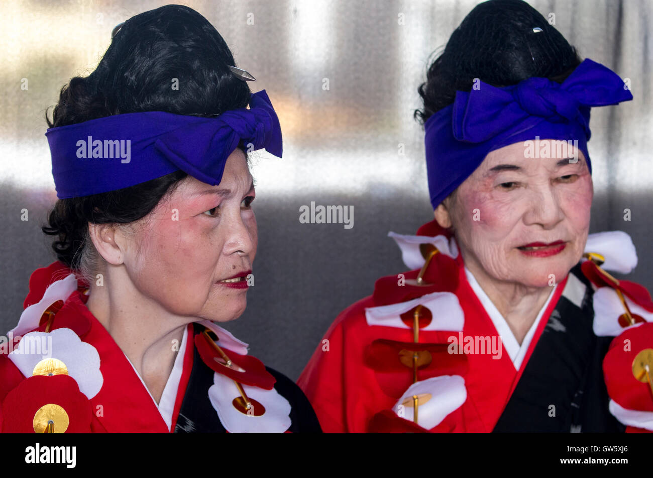 Elderly Okinawans in traditional costume. Stock Photo